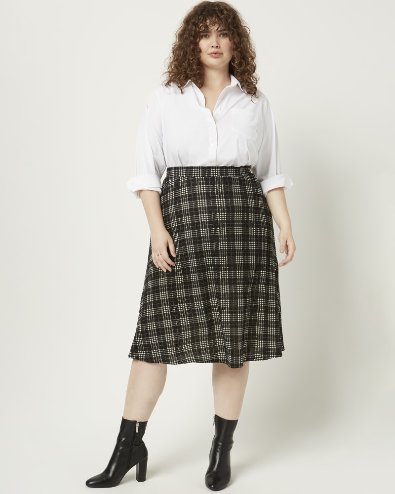 Front of a model wearing a size 1X Angelique Plaid Midi Skirt in Black / White by Meri Skye. | dia_product_style_image_id:216091